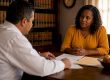 Client and lawyer reviewing QDRO documents