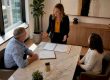 Attorney consulting couple about divorce mediation