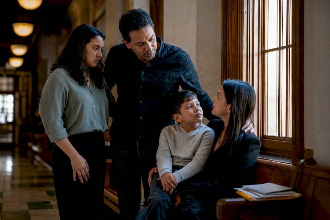 Parent and child walking in courthouse hallway