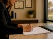 Hands setting court document on bench