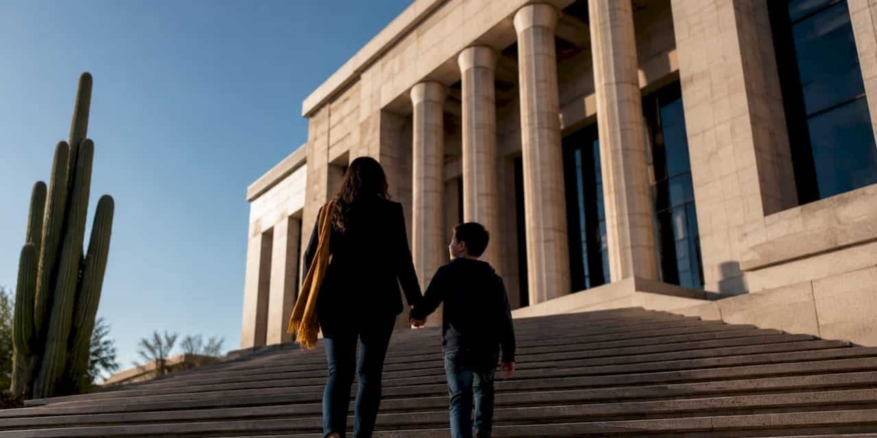 Mother and child approaching family courthouse