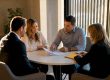 Spouses reviewing collaborative divorce agreement