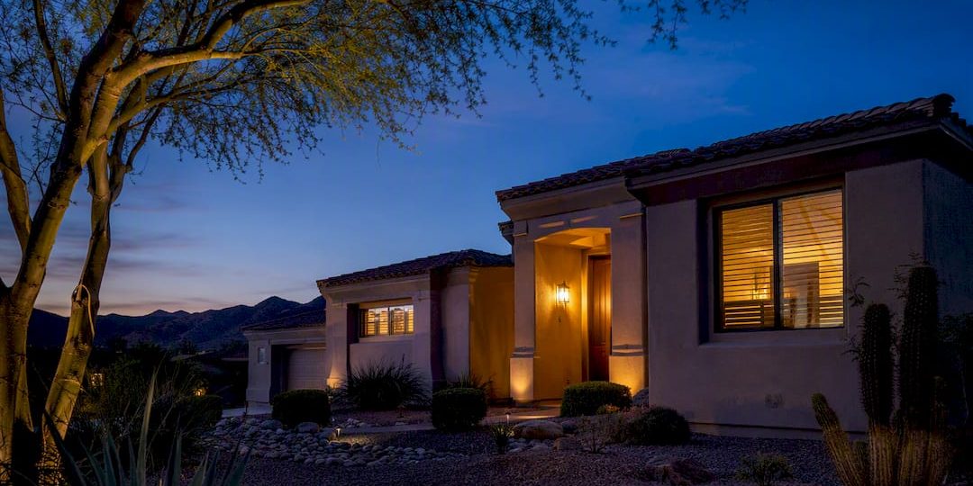 Arizona home at twilight with desert landscaping