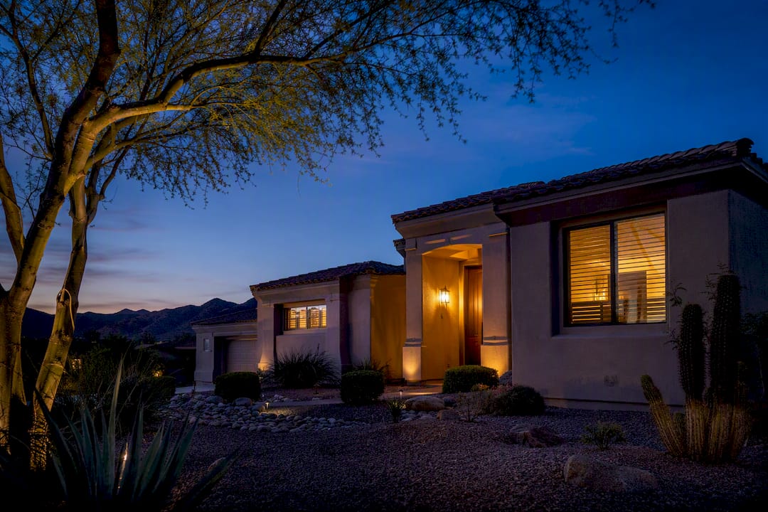 Arizona home at twilight with desert landscaping