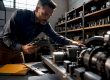Appraiser inspecting small business equipment
