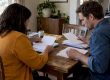 Couple sorting student loan documents during divorce