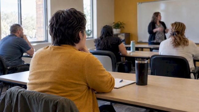 Parent attending an Arizona education class