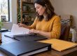Parent organizing exhibits in a trial binder